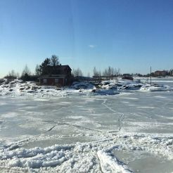 House on what would ordinarily have been an island, now icebound.